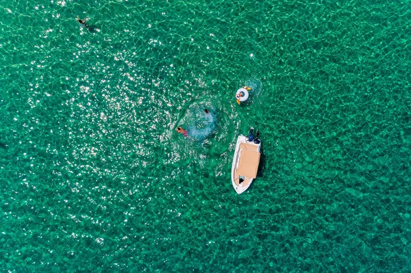 Top view of people in floats at the ocean at Chalkidiki, Greece. — Stock Photo, Image