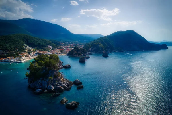 Aerial cityscape view of the coastal city of Parga, Greece durin