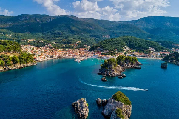 Aerial cityscape view of the coastal city of Parga, Greece durin