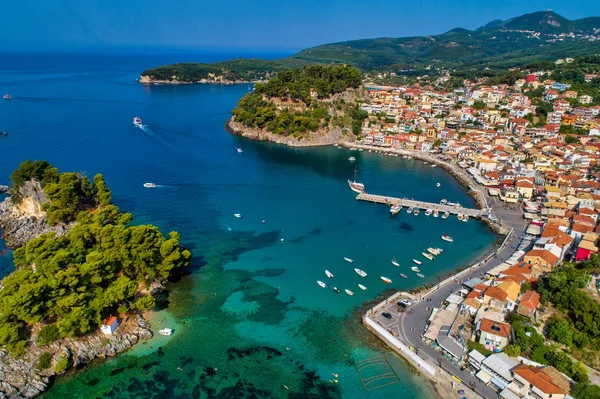 Aerial cityscape view of the coastal city of Parga, Greece durin