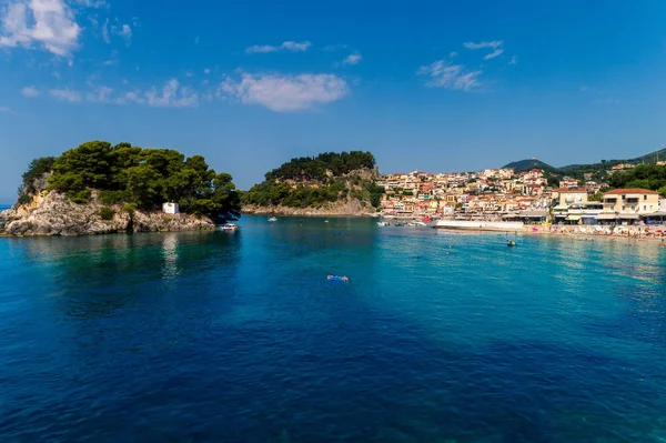 Aerial cityscape view of the coastal city of Parga, Greece durin