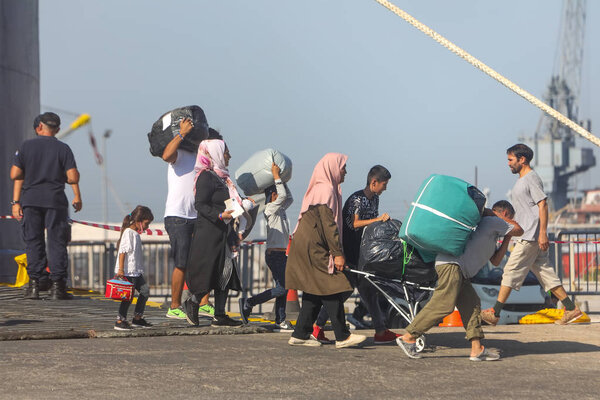 Refugees and migrants disembark to the port of Thessaloniki afte