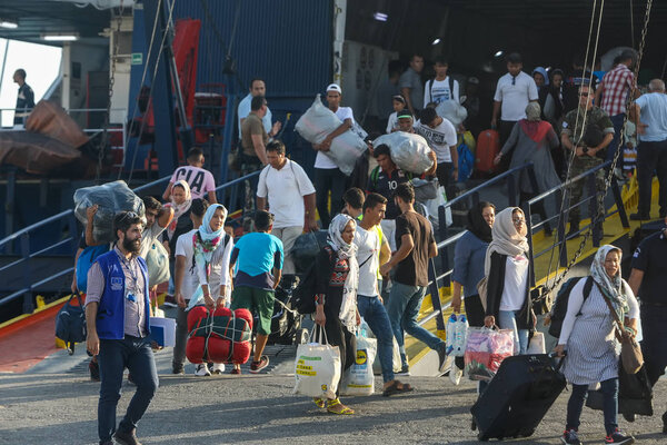 Refugees and migrants disembark to the port of Thessaloniki afte