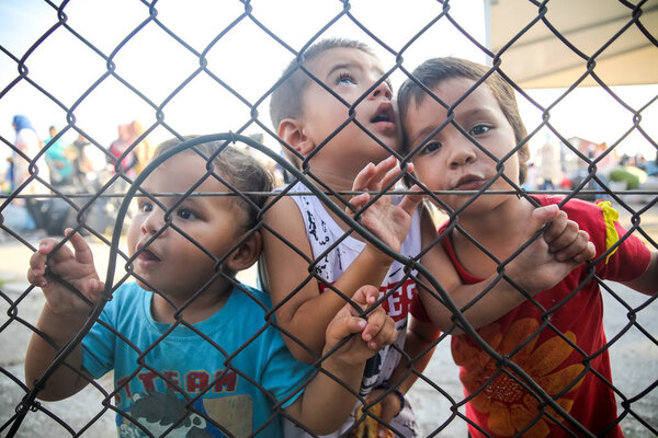 Refugee children disembark in the port of Thessaloniki after bei