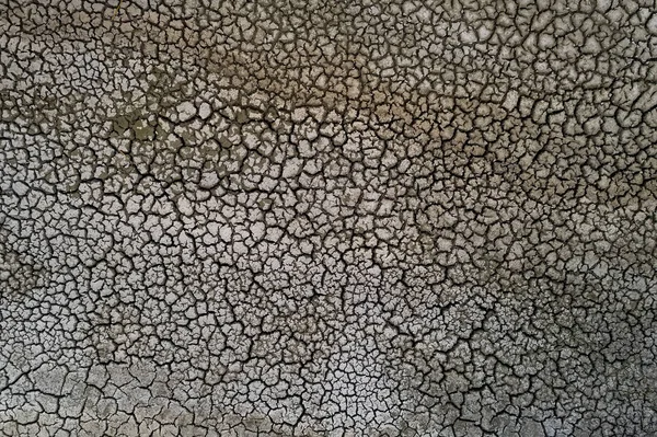 Cama de lago seco com textura natural de argila rachada em perspectiva — Fotografia de Stock
