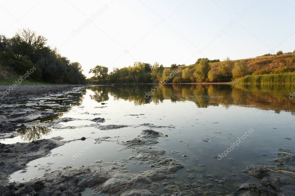 Dried lake at sunset, summer time