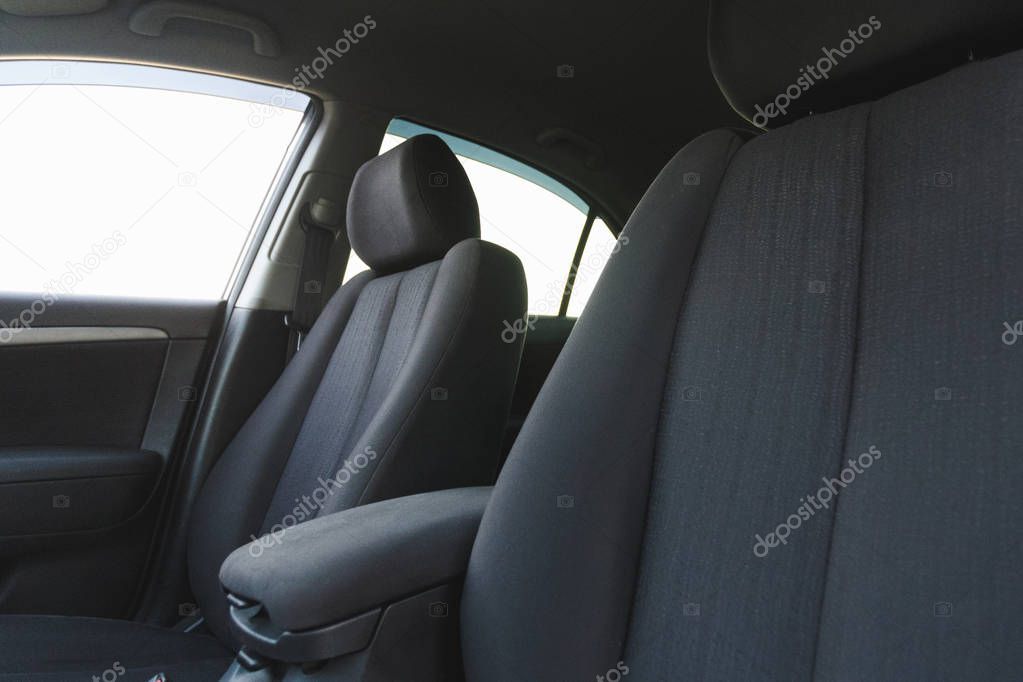 Car interior, part of front seats, close