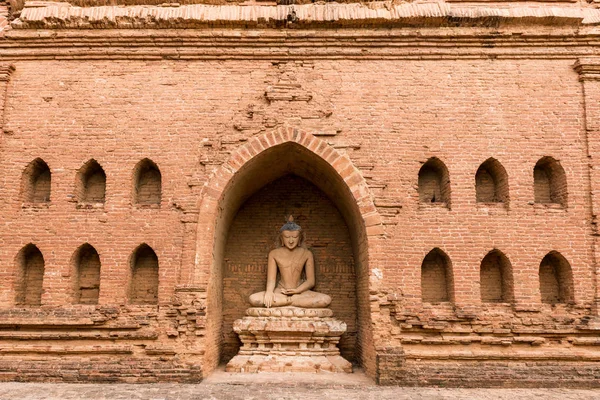Horizontal picture of amazing buddha statue in the ruin of buddhist temple at Bagan archeological park in Myanmar