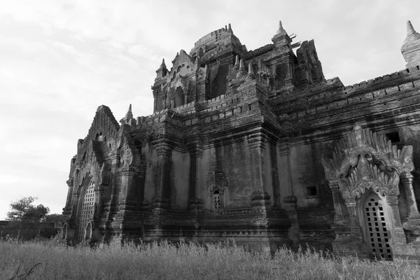 Black and white picture of beautiful sunset light in the walls of Thitsarwadi Temple located in Bagan, Myanmar