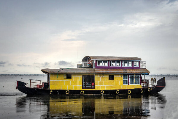 Houseboat yellow image with blue sky and cloud