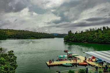 lake pristine with forest water reflection at morning image is taken at pykara lake ooty tamilnadu india on May 10 2020. clipart