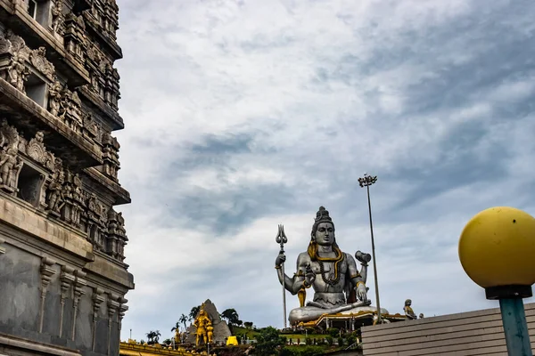 lord shiva statue at early in the morning from unique angle image is take at murdeshwar karnataka india at early morning. it is one of the tallest shiva statue in the world.