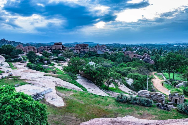 sun set point hampi with dramatic sky at dusk shot is taken at hampi karnataka india. it is showing the natural beauty of hampi at dusk.