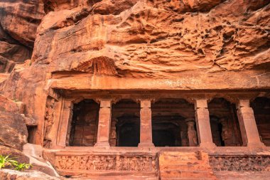 badami cave no one chalukya dynasty ancient stone art from flat angle image is taken at badami karnataka india. it is unesco heritage site and place of amazing chalukya dynasty sotne art. clipart