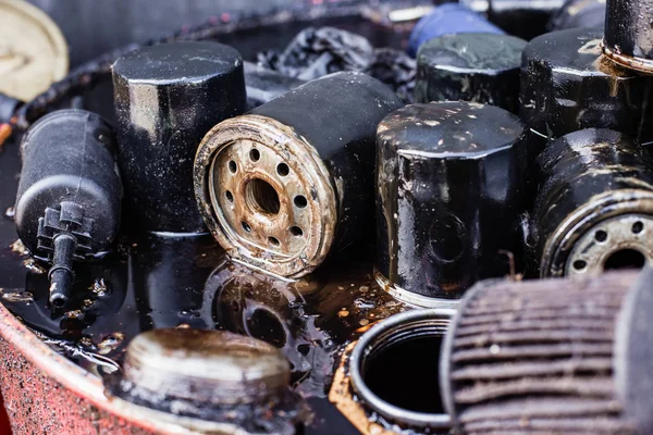 Group of old oil filters of the car with a shallow depth of field — Stock Photo, Image