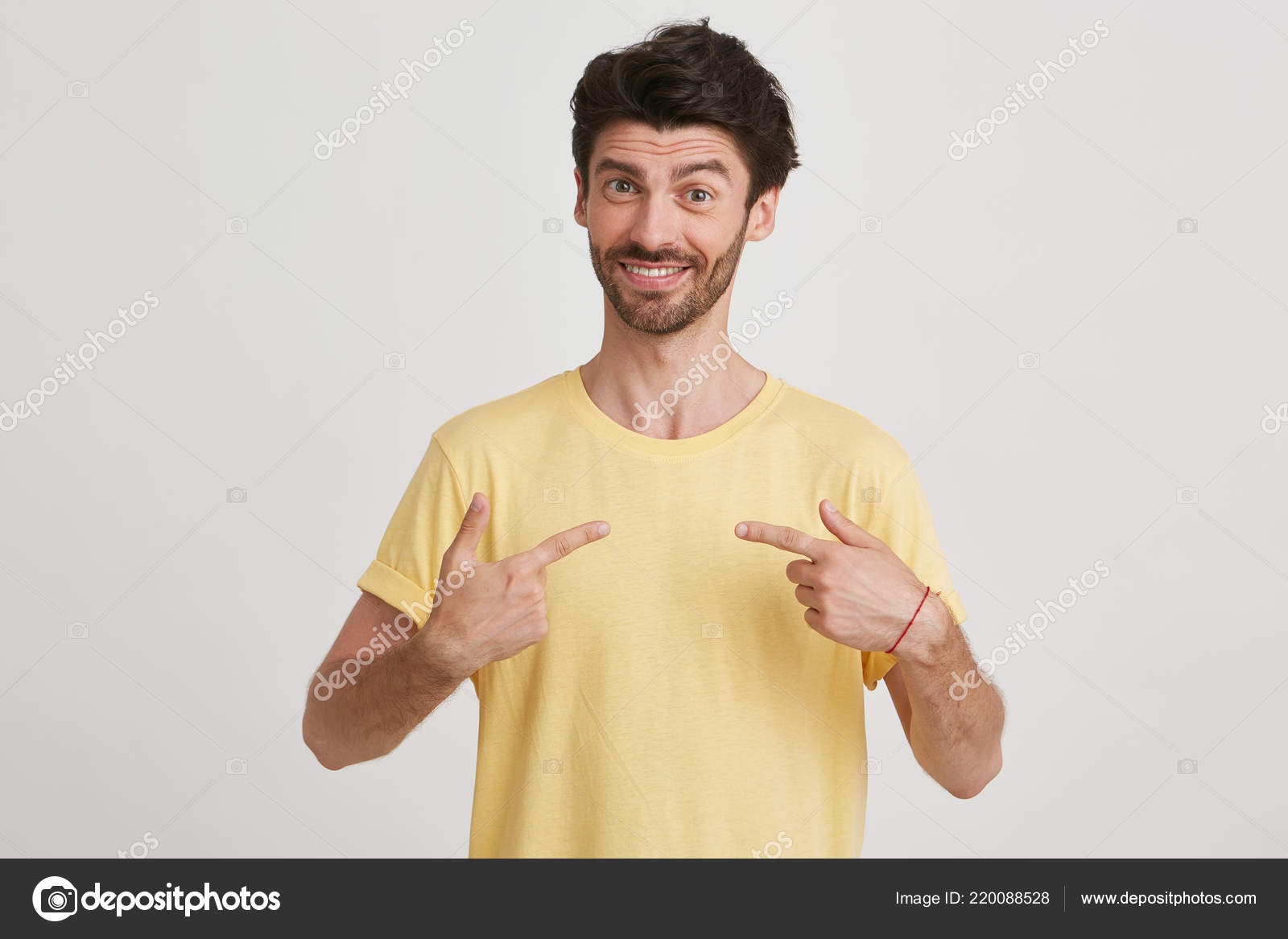 Smiling Young Man Dark Brown Hair Beard Shows Fingers Himself