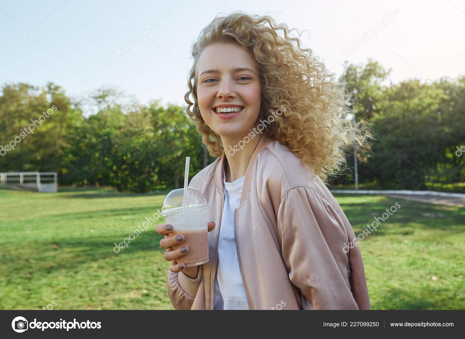 Young Beautiful Girl Blonde Curly Hair Walks Park Drinking