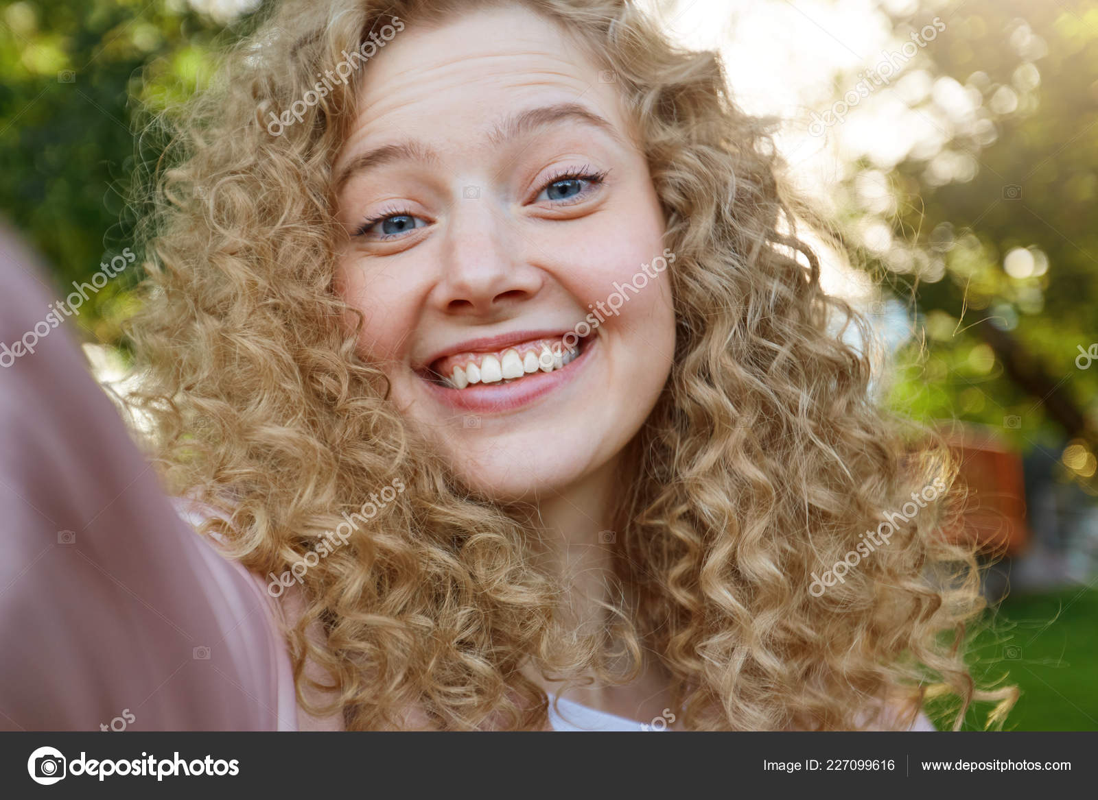 Young Beautiful Funny Cool Girl Blonde Curly Hair Widely Smiling Stock  Photo by ©timtimphoto 227099616