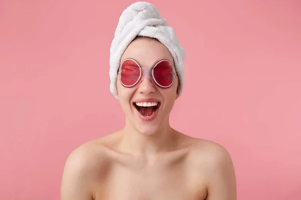 Wow! So cool! Young happy amazed woman after spa mask on eyes an