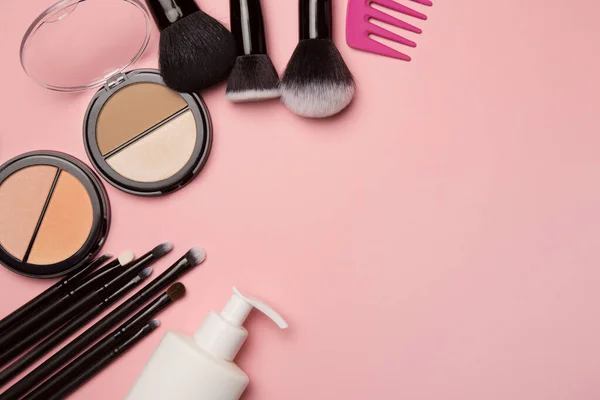Makeup cosmetics on pink backgroundmetics on pink background