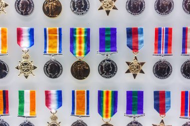 Close up shot of various war medals on display clipart