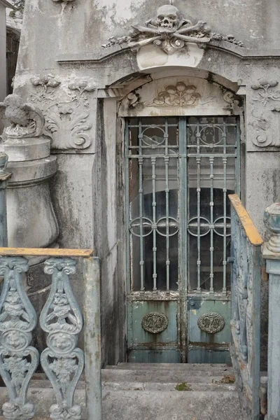 Creepy and bizarre european old cemetery vault.