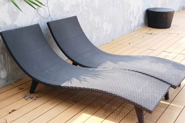 Cozy daybed with umbrellas by the pool — Stock Photo, Image