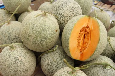Fresh melon or cantaloupe in the market clipart