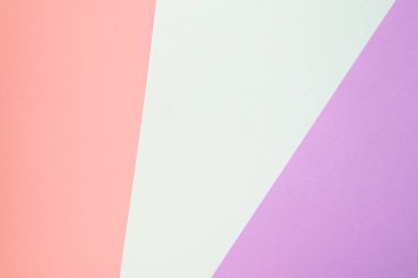 Trendy geometric diagonal abstract texture of pink, violet and blue papers. Design background concept
