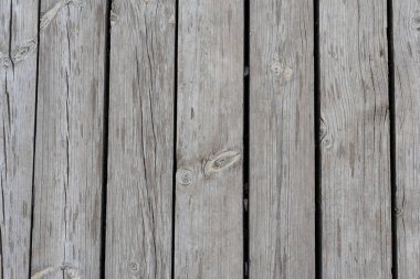 Eski gri ahır ahşap arka plan dokusu çizikler ve çatlaklarla yakın plan