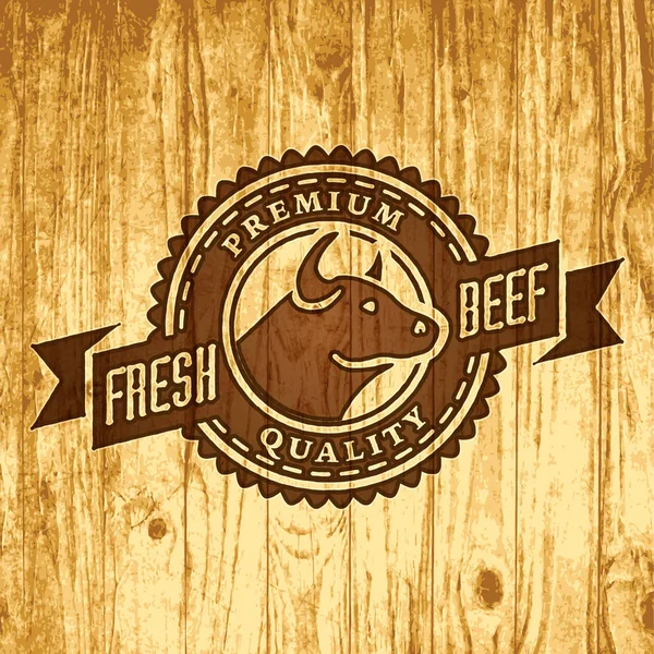 Logotipo de vetor de loja de carne ou talho em fundo de madeira — Vetor de Stock