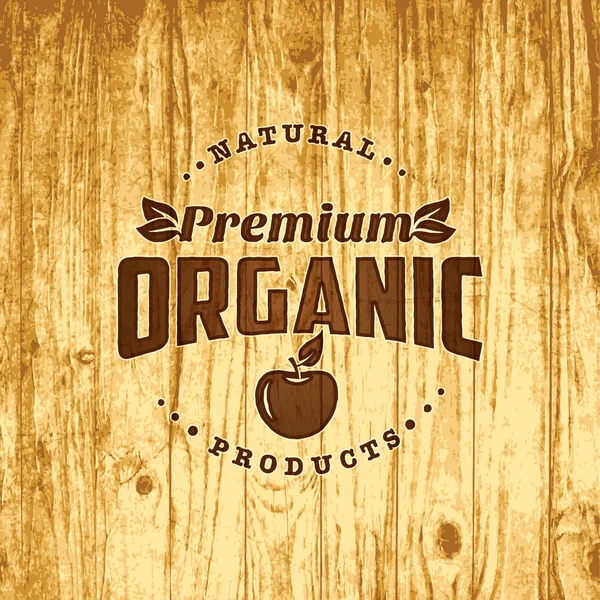 Naturale biologico logo alimentare su sfondo di legno — Vettoriale Stock