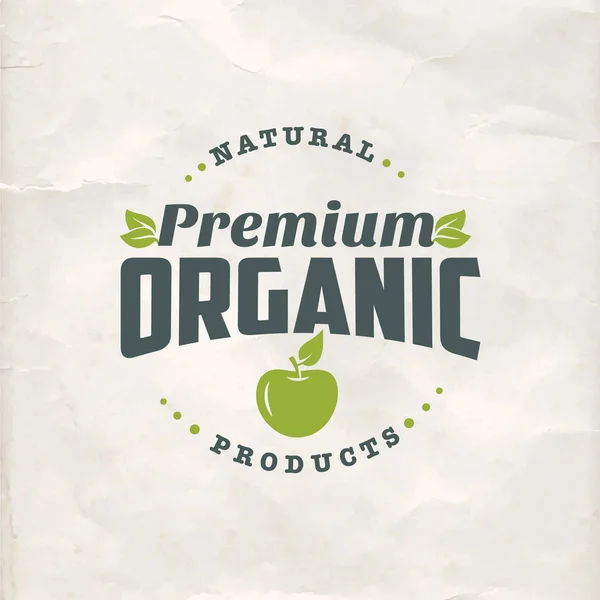 Logo plano de alimentos orgánicos naturales sobre fondo de papel — Vector de stock