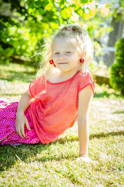 Adorable Blond Girl Cherry Fruit Ears Sitting Green Grass — Stock Photo, Image