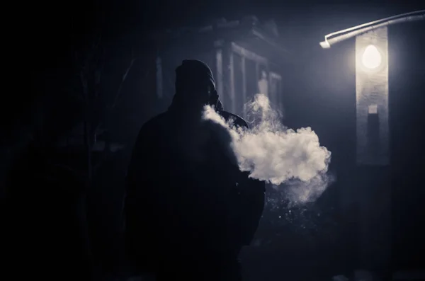 Strange man at night smoking — Stock Photo, Image