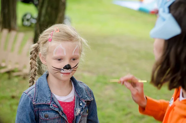 Smiling girl with face painting of mouse — Stock Photo, Image