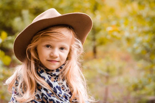 Little child  with long blond hair and hat — Stock Photo, Image