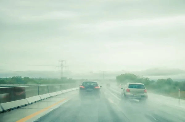 Misty road during rainy day — Stock Photo, Image