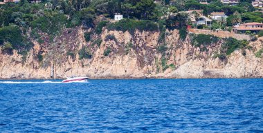 Spain, Catalonia, July 2018. Travel by boat Costa Brava: Calella, Pineda, Santa Susanna. Malgrat de Mar, Blanes, Santa Cristina, Lloret de Mar, Tossa.