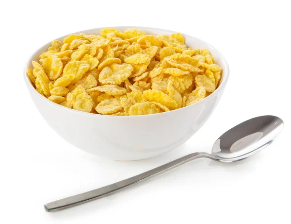 白色碗盘中的金黄色片状 白色表面和勺子 — 图库照片