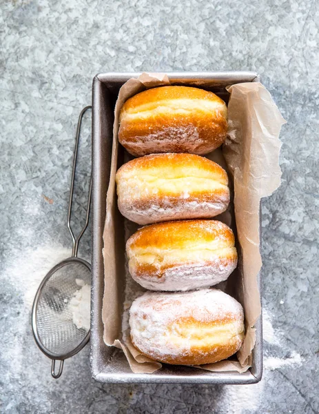 sweet baked donuts in box