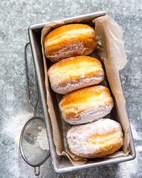 sweet baked donuts in box