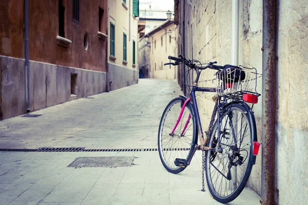 Vintage bike on a European street. Healthy lifestyle. Romantic city view. Mediterranean town. Bike ride