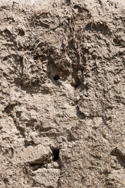 Çamur ve kil arka plan. Çamur, çimen ve samandan oluşan eski bir yapı malzemesi. Van 'daki tarihi kalenin duvarları.