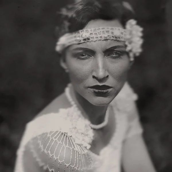 Wet-plate. Collodion photography of young woman in white vintage dress.