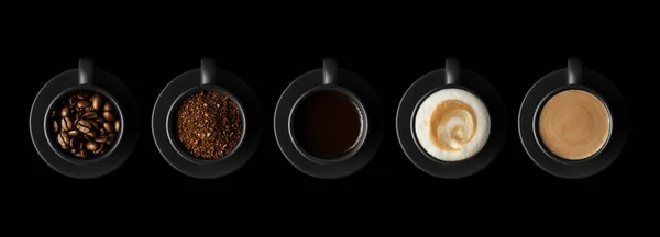 Pięć czarnych filiżanek kawy z różnymi kawami — Zdjęcie stockowe