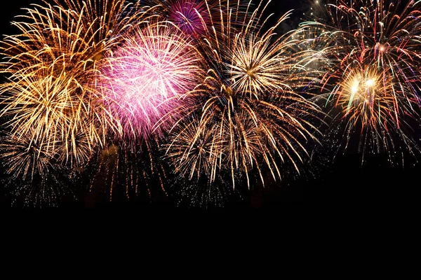 Fireworks display on dark sky background — Stock Photo, Image