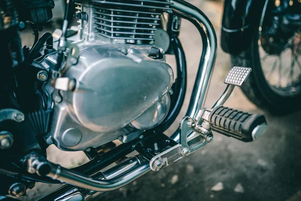 Closeup of motorcycle engine  on background