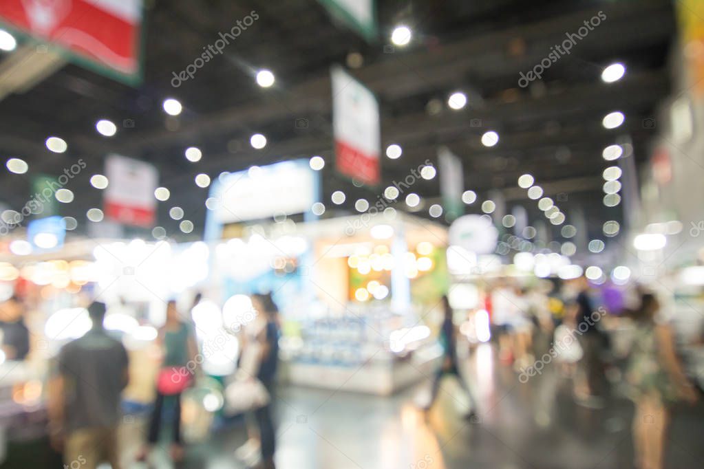 Abstract people walking in exhibition blurred background