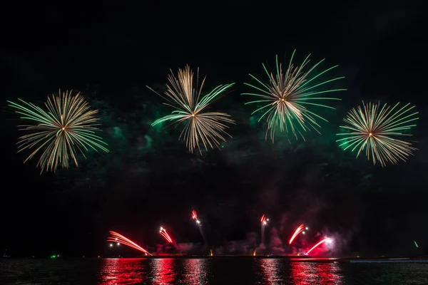 Beautiful firework display for celebration over the sea — Stock Photo, Image